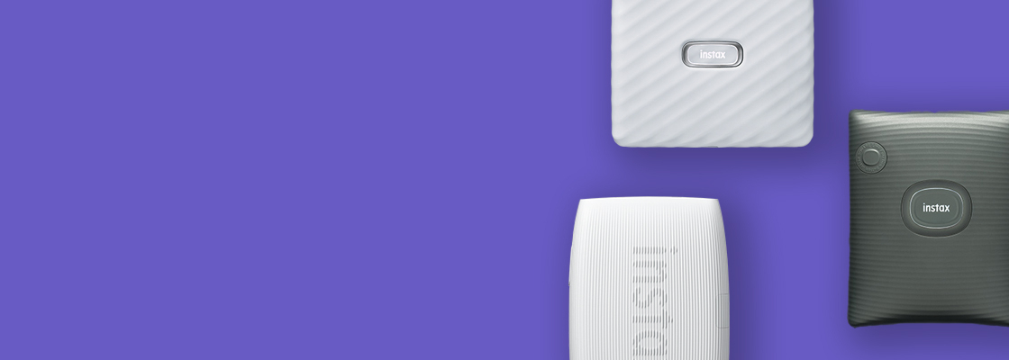 purple banner with three different printers