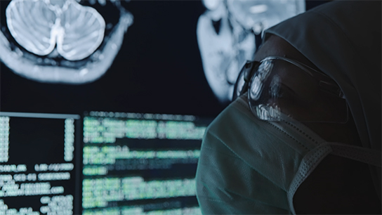 Physician reviewing CT images