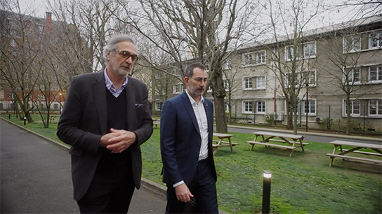 Christophe and a doctor walking in the hospital garden