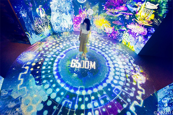 [photo] Woman standing in the middle of a circle in the middle of a room with various multicolored lights all around