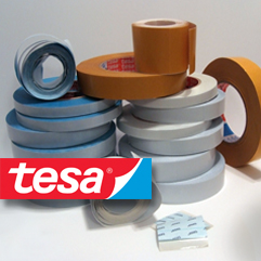[photo] A stack of mounting tapes with a red and blue tesa logo stamp