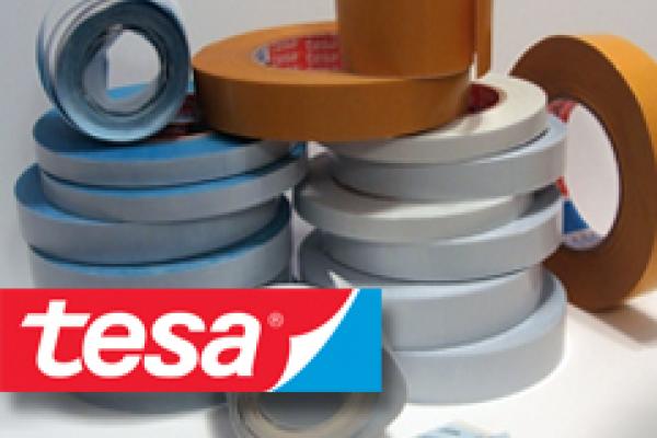 [photo] A stack of mounting tapes with a red and blue tesa logo stamp