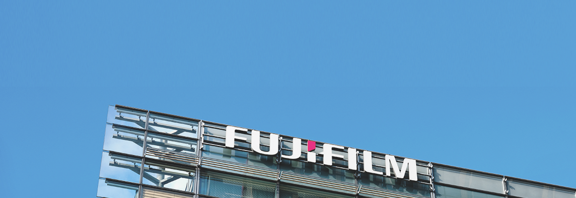 [image] Corporate building with large Fujifilm text logo on corner of building